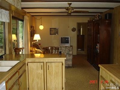 1945 Piner Road, Unit 72 Santa Rosa, CA 95403 - Photo 5 of 6 a bathroom with a granite countertop sink a mirror and shower