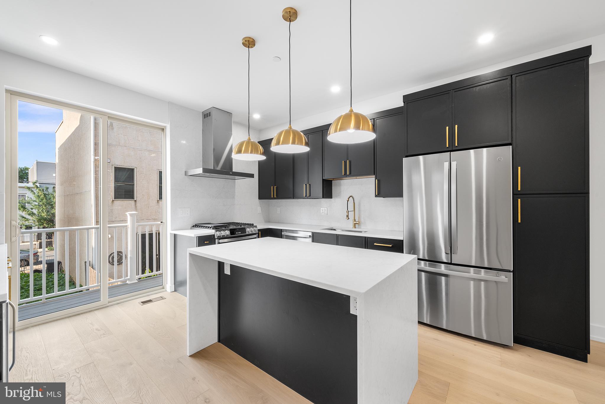 2336 Alter Street Philadelphia, PA 19146 - Photo 1 of 40 a kitchen with stainless steel appliances granite countertop a refrigerator a sink and a stove