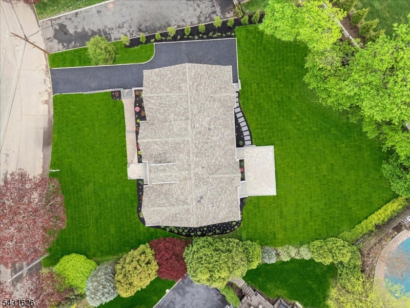 34 Crestview Avenue Madison, NJ 07940 - Photo 3 of 45 an aerial view of a house with a yard