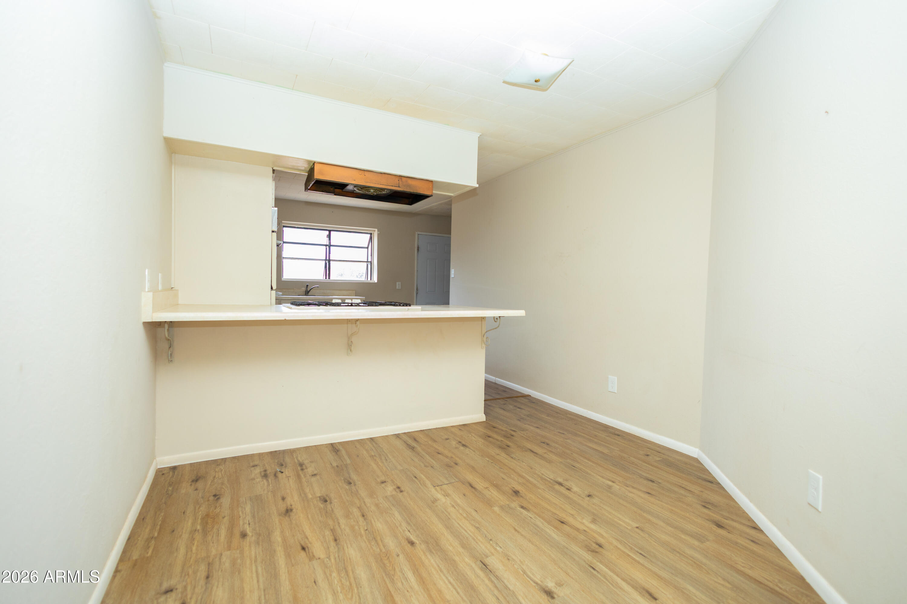 1626 11th Street Douglas, AZ 85607 - Photo 18 of 30 a view of kitchen cabinets and wooden floor