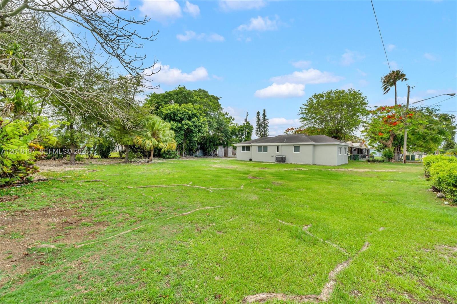 628 Southwest 8th Avenue Homestead, FL 33030 - Photo 4 of 25 a view of a house with a yard
