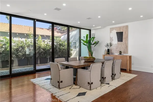 a view of entryway with wooden floor and stairs