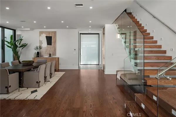 a bedroom with a large bed and a large window