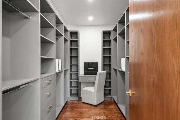 a bedroom with a large bed and a large window