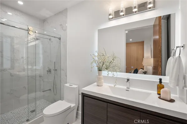 a view of a workspace with furniture and window