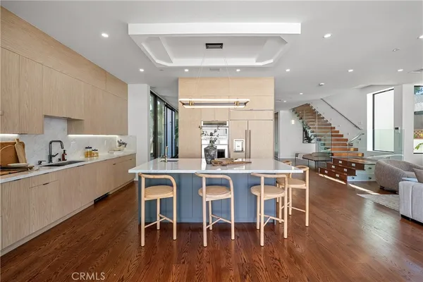 a kitchen with a sink cabinets and window