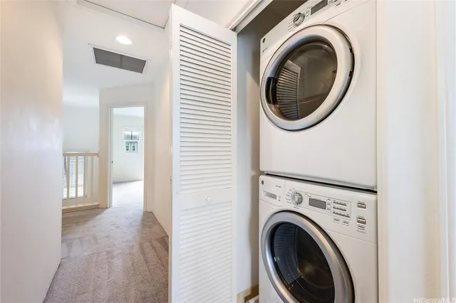 a view of a hallway with washer and dryer