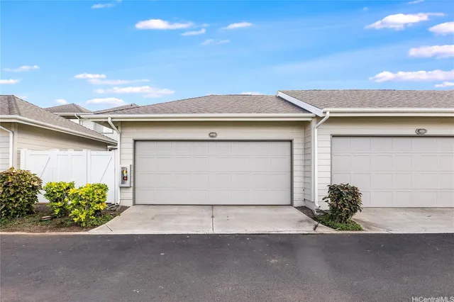 a front view of a house with a garage