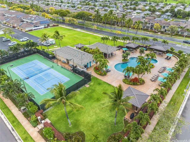 an aerial view of a pool yard swimming pool and outdoor seating