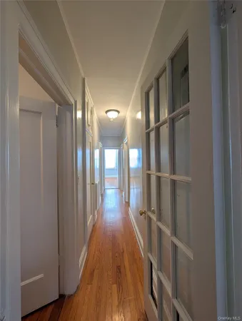 a view of gallery with wooden floor