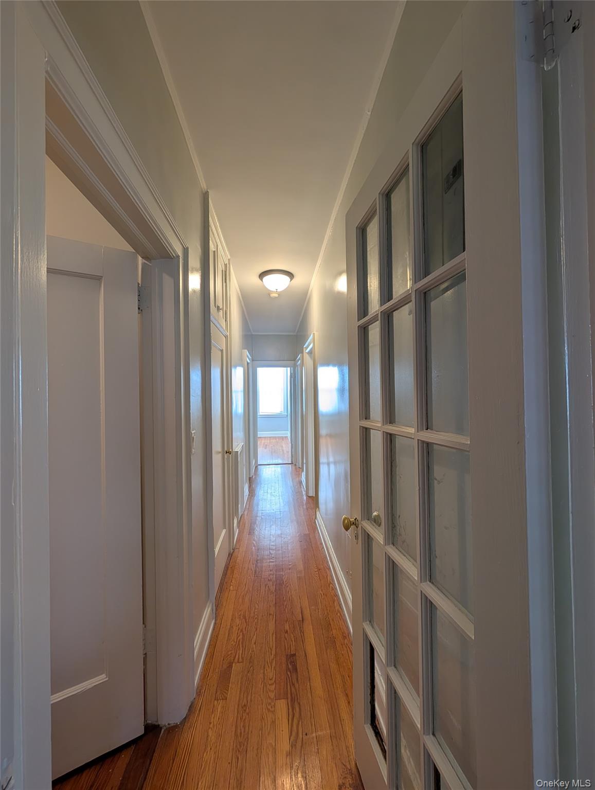 26 Coligni Avenue, Unit 12 New Rochelle, NY 10801 - Photo 16 of 18 a view of gallery with wooden floor
