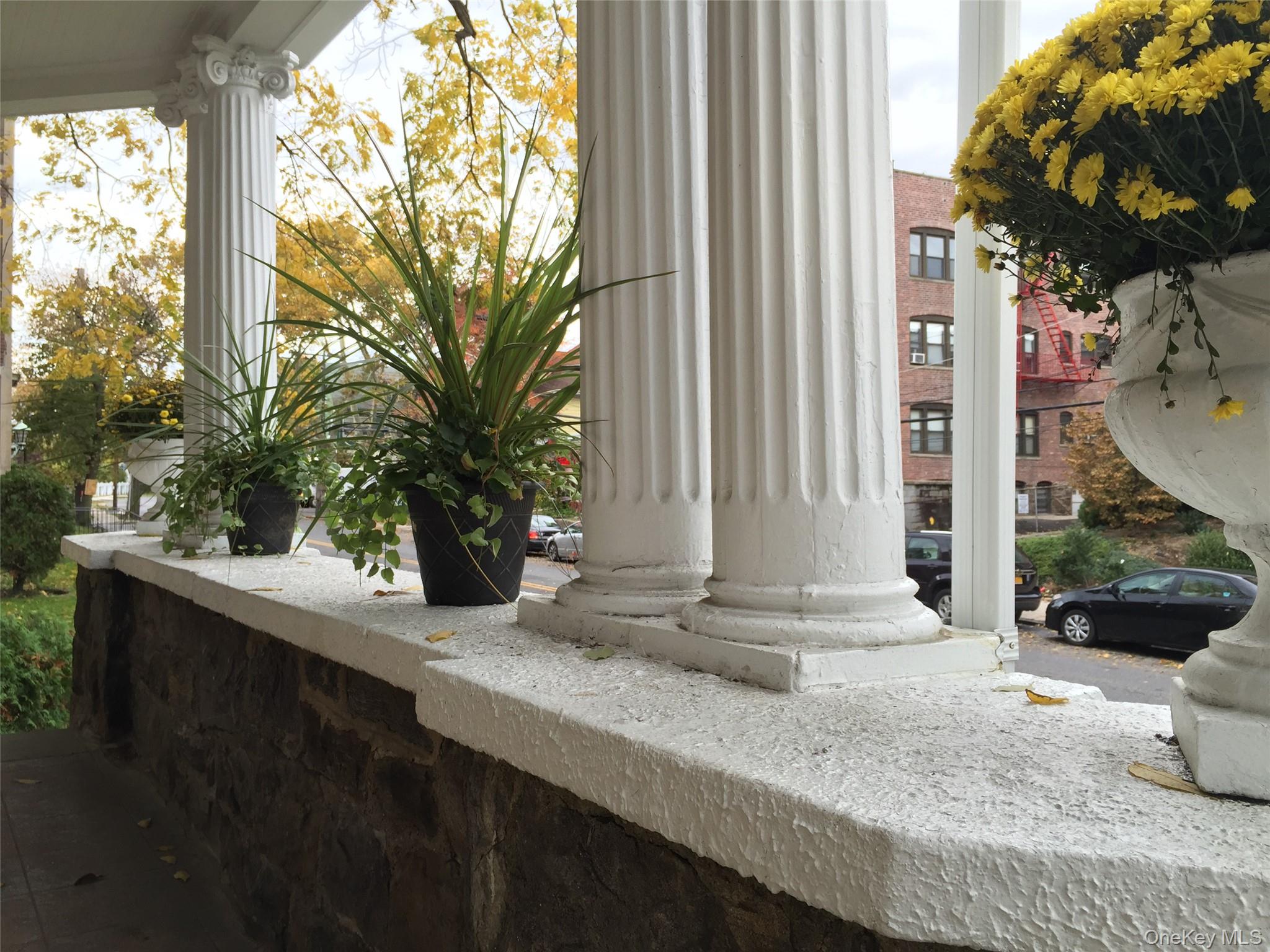 26 Coligni Avenue, Unit 12 New Rochelle, NY 10801 - Photo 2 of 18 a front view of a house with garden