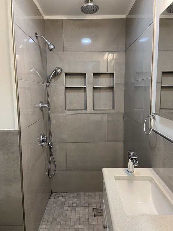 252 Windsor Street, Unit 3 Cambridge, MA 02139 - Photo 5 of 21 a bathroom with a sink toilet and shower