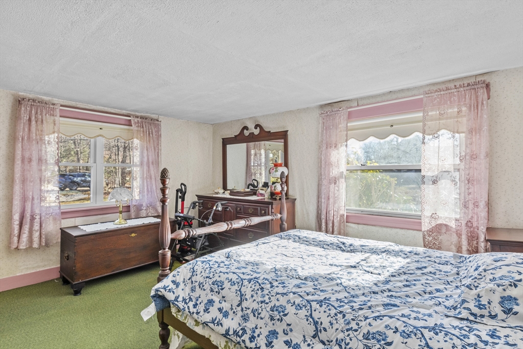 7 Wendover Road Holden, MA 01520 - Photo 13 of 28 a bedroom with a bed and a dresser next to a window