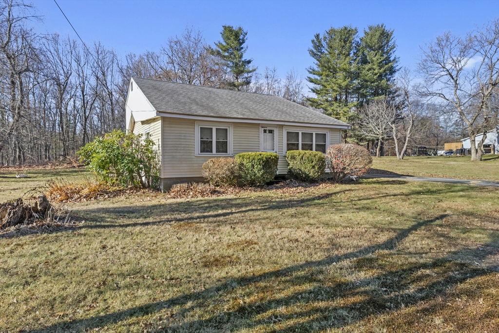 7 Wendover Road Holden, MA 01520 - Photo 3 of 28 a front view of house with yard and trees