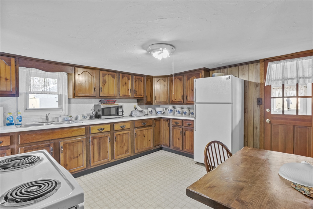 7 Wendover Road Holden, MA 01520 - Photo 6 of 28 a kitchen with sink cabinets and window