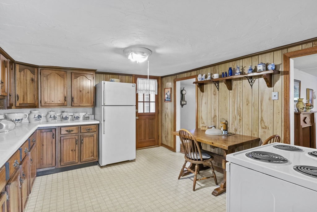 7 Wendover Road Holden, MA 01520 - Photo 7 of 28 a kitchen with a refrigerator a stove and a sink
