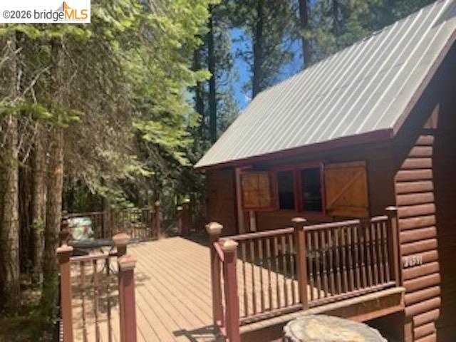 26591 Snow Bowl Road Long Barn, CA 95335 - Photo 28 of 38 a view of a house with a wooden fence