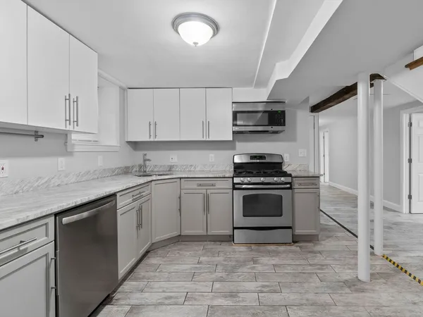 a kitchen with a stove and a sink