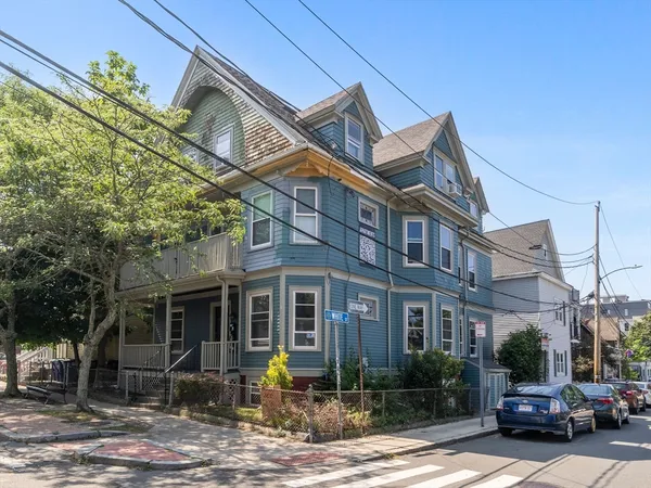 a front view of a building with garden