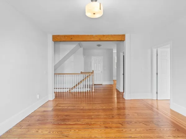 a view of entryway with wooden floor
