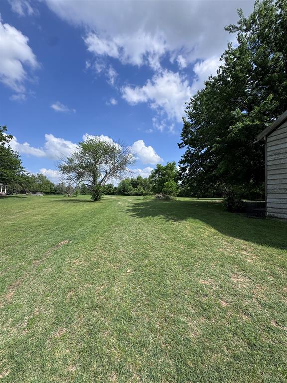 806 Old Base Road Aurora, TX 76078 - Photo 12 of 23 a view of a lake with a big yard