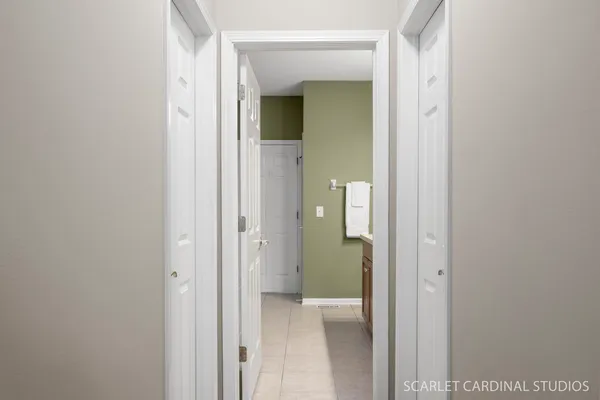 a view of a bathroom from a corridor