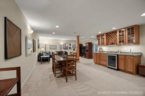 a kitchen with stainless steel appliances kitchen island granite countertop a sink and cabinets