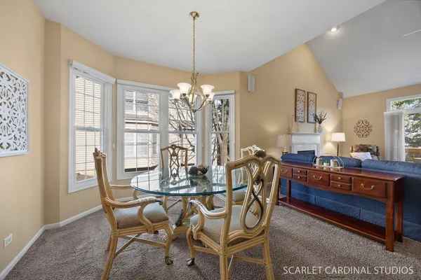 a view of a dining room with furniture and window