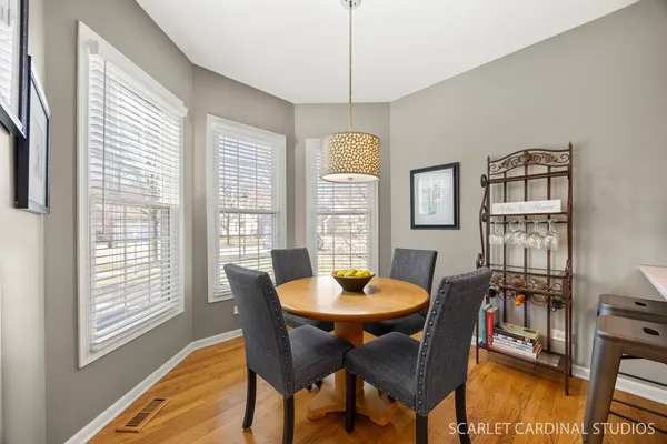 a view of a dining room with furniture window and wooden floor