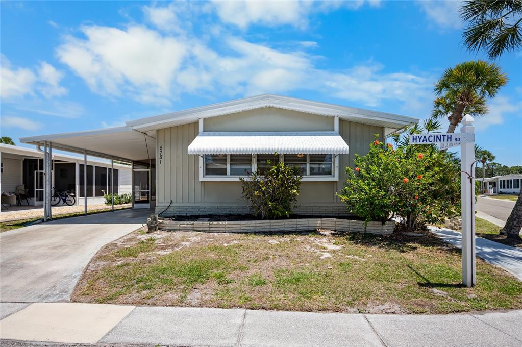 5751 Hyacinth Road Venice, FL 34293 - Photo 30 of 44 a front view of a house with garden