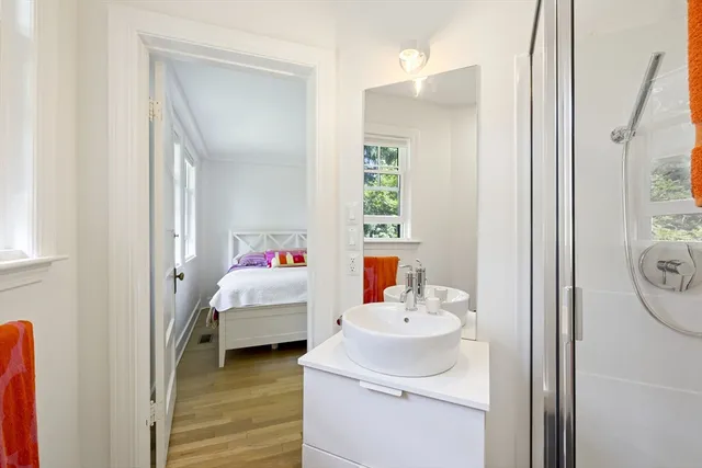 a en suite bathroom with a sink and a mirror