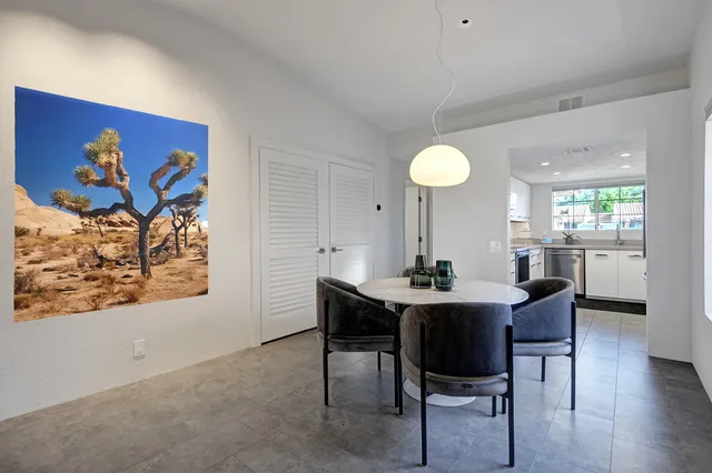a bathroom with a double vanity sink toilet mirror and shower