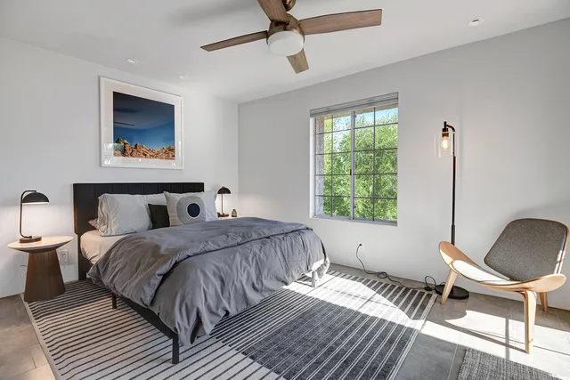 a kitchen with stainless steel appliances granite countertop white cabinets a sink and a stove