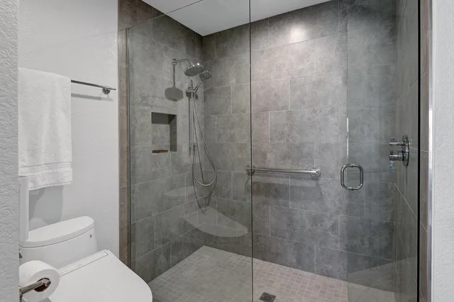 a front view of a house with swimming pool yard and outdoor seating