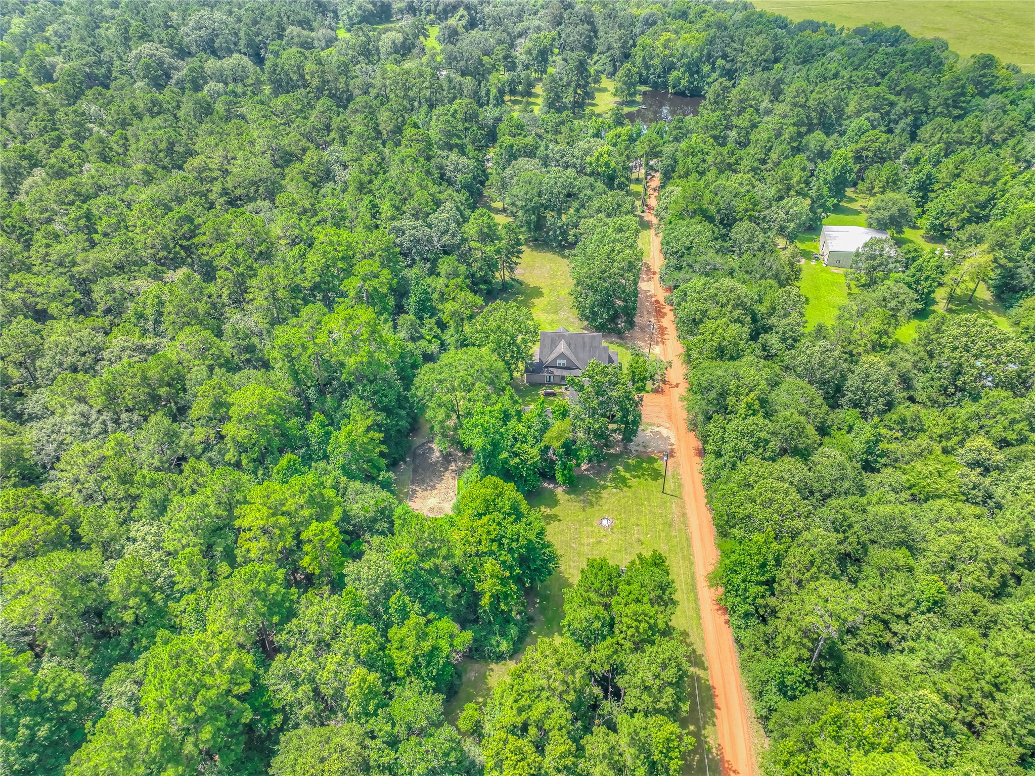 110 Happy Trails Road Coldspring, TX 77331 - Photo 38 of 49 a view of a garden
