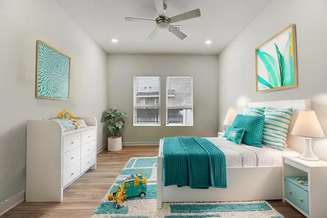 a living room with a bed furniture and a window