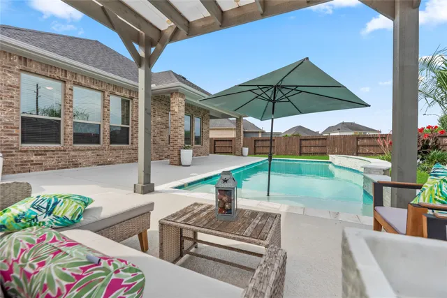 a view of a backyard with a patio