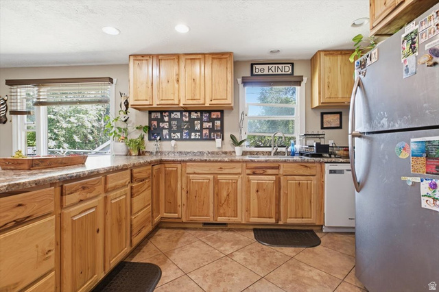 565 East 800 North Logan, UT 84321 - Photo 5 of 27 Kitchen featuring wood cabinetry, laminate countertops, tile flooring, and recessed lighting