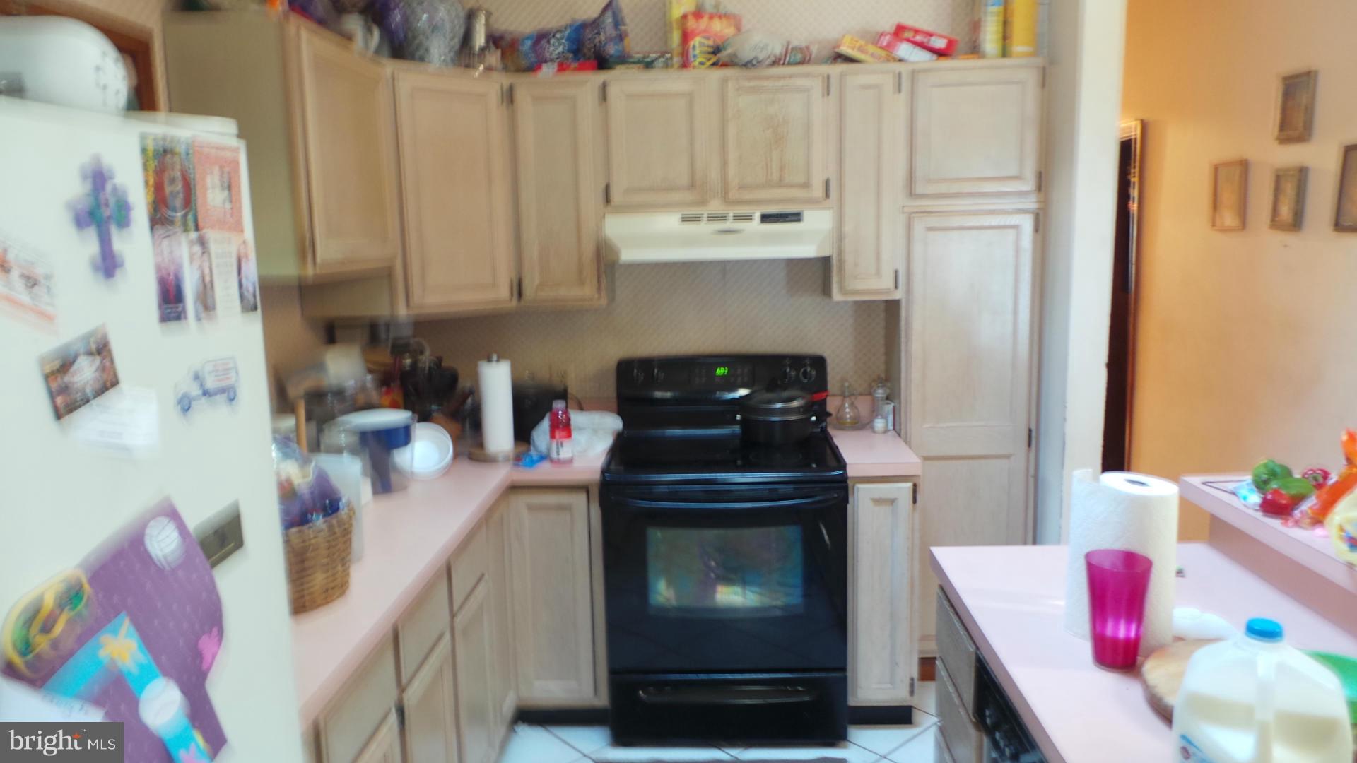 318 Dorchester Road Pasadena, MD 21122 - Photo 4 of 11 a view of a kitchen with appliances and cabinets