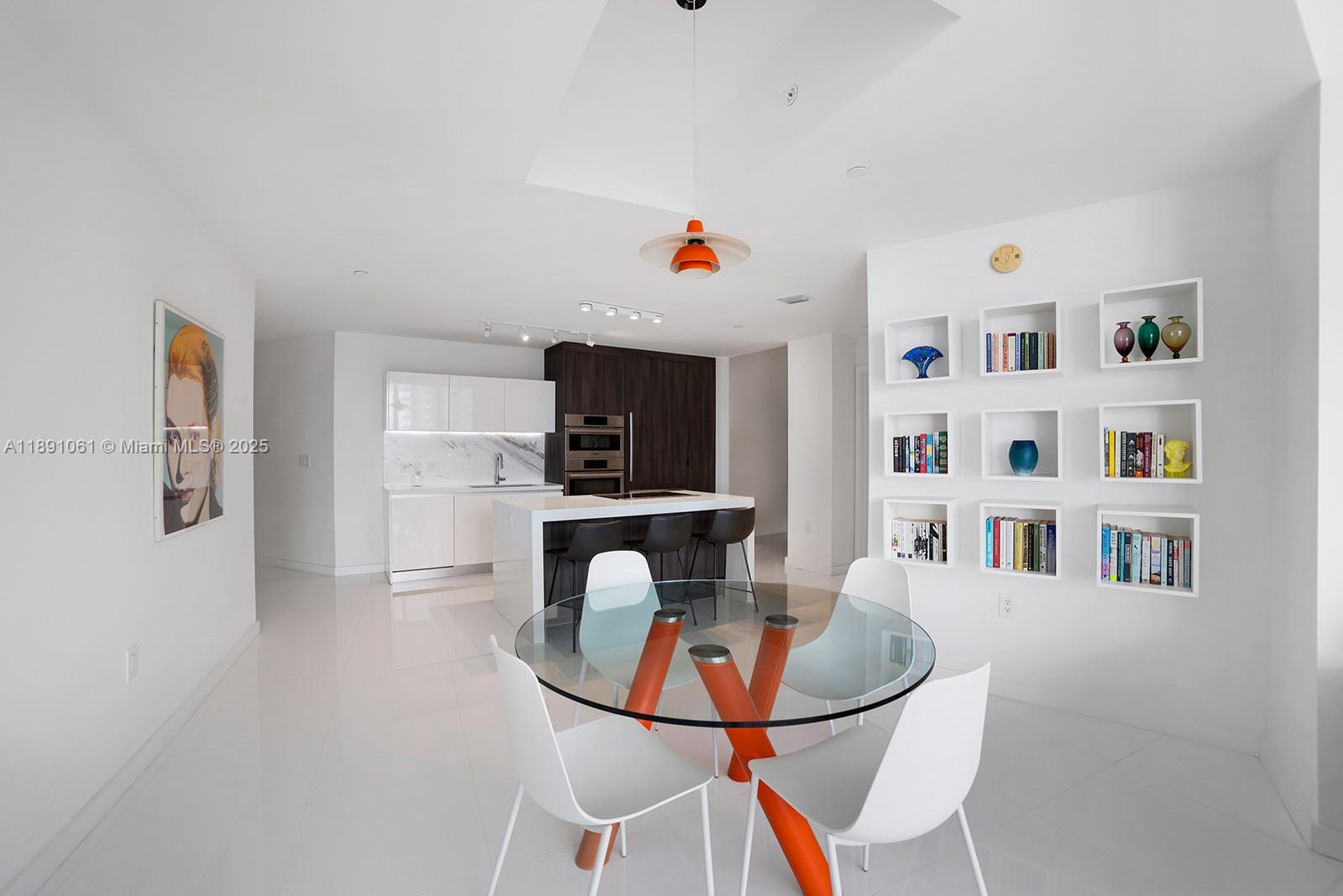 851 Northeast 1st Avenue, Unit 4403 Miami, FL 33132 - Photo 4 of 31 a living room with furniture cabinets and a table