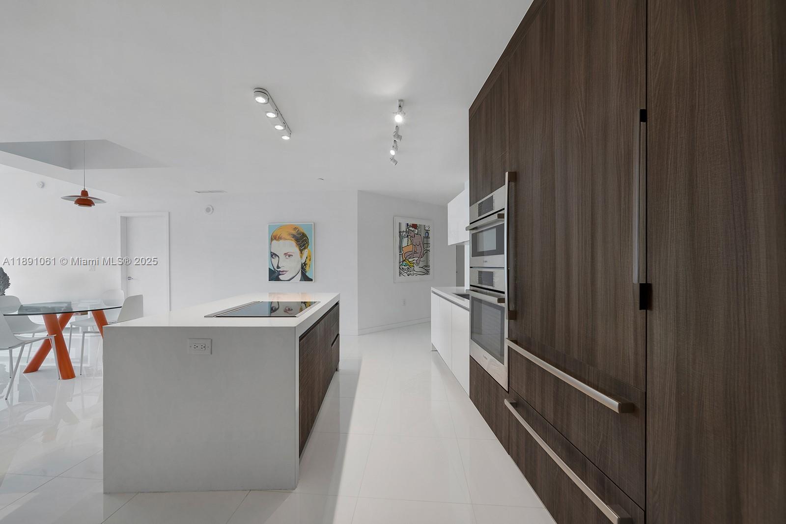 851 Northeast 1st Avenue, Unit 4403 Miami, FL 33132 - Photo 7 of 31 a view of a kitchen with furniture and a kitchen