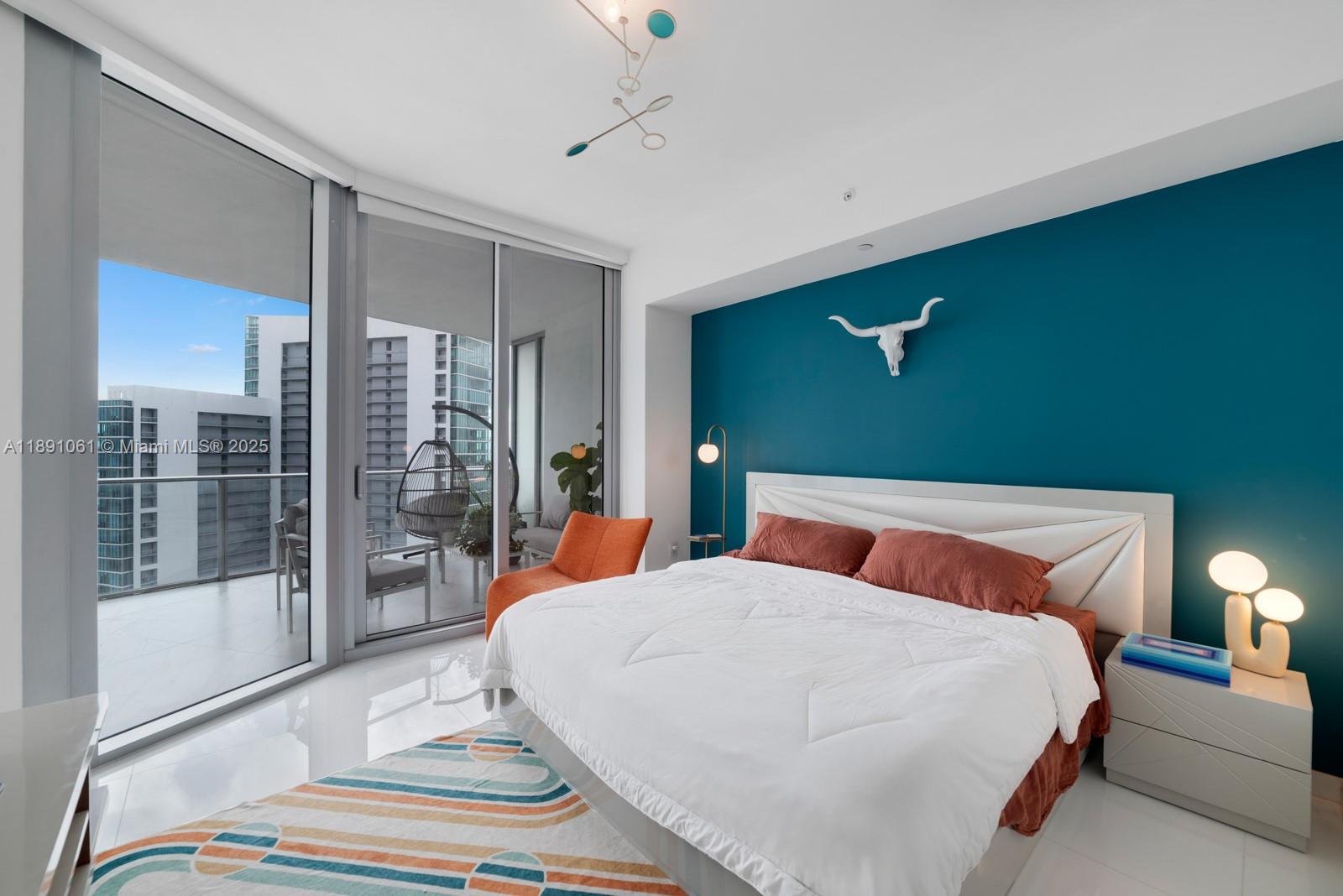 851 Northeast 1st Avenue, Unit 4403 Miami, FL 33132 - Photo 8 of 31 a bedroom with a bed and window