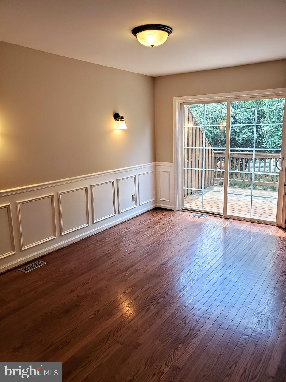 109 Harbour Ridge Lane Downingtown, PA 19335 - Photo 6 of 16 a view of an empty room with wooden floor and a window