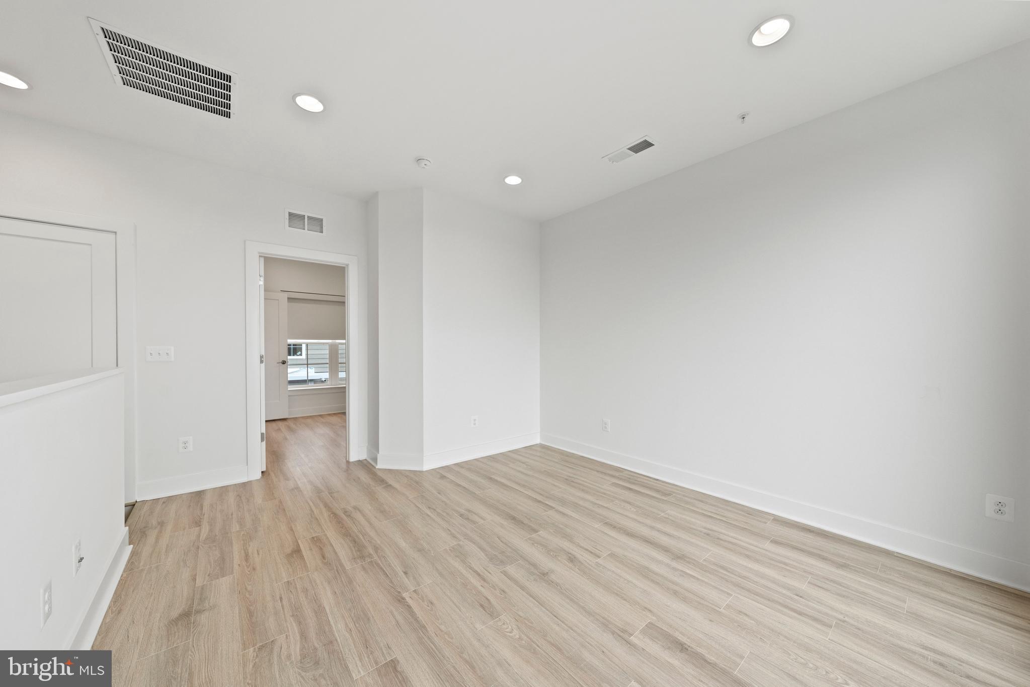 11249 Beaker Street Reston, VA 20190 - Photo 15 of 32 wooden floor in an empty room with a window