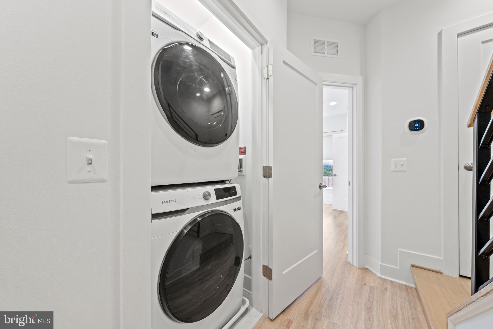 11249 Beaker Street Reston, VA 20190 - Photo 32 of 32 a view of a hallway with washer and dryer