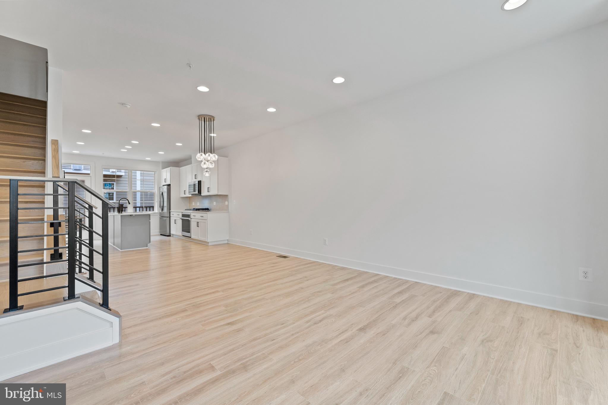 11249 Beaker Street Reston, VA 20190 - Photo 10 of 32 a view of kitchen with furniture and wooden floor