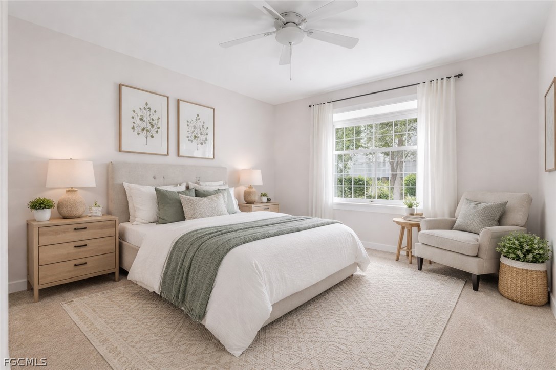 13110 Pebblebrook Point Circle, Unit 102 Fort Myers, FL 33905 - Photo 12 of 35 a bedroom with a bed and a couch