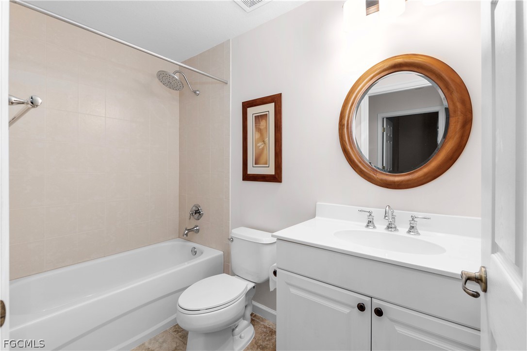13110 Pebblebrook Point Circle, Unit 102 Fort Myers, FL 33905 - Photo 16 of 35 a bathroom with a sink toilet and shower