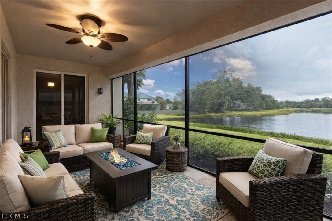 13110 Pebblebrook Point Circle, Unit 102 Fort Myers, FL 33905 - Photo 18 of 35 a living room with furniture and a large window